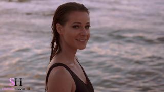 Melisa Mendini looks stunning in her Heaven Sunset Swimsuit on the beach during sunset